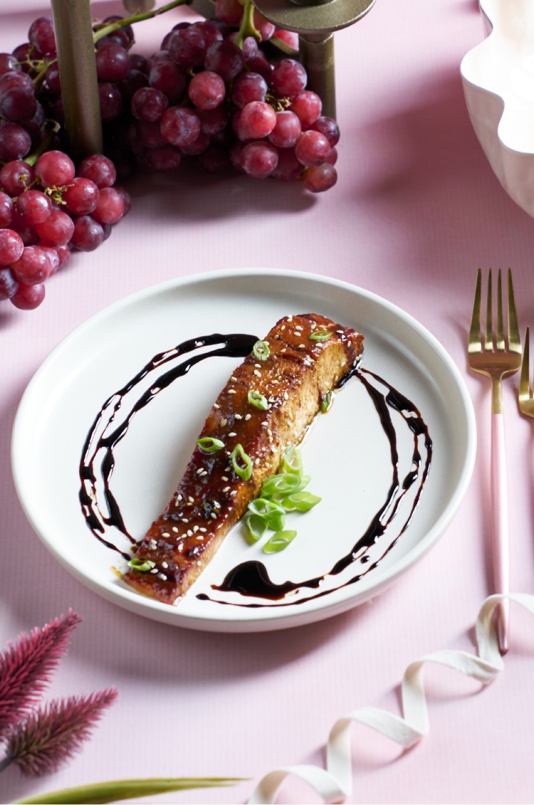 Glazed salmon fillet on a white plate